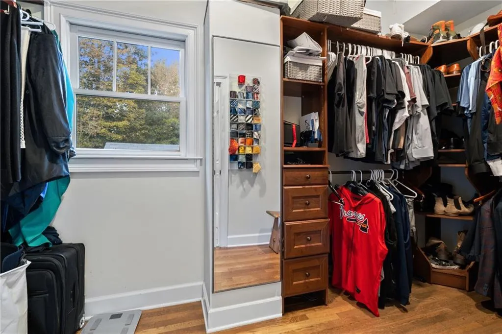 Walk in closet featuring light wood-style floors