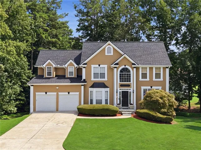 Stucco exterior with white trim details