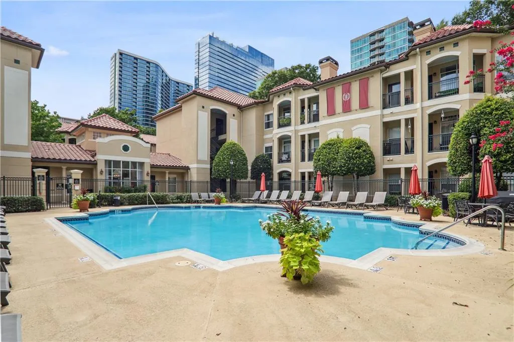 Community pool with a patio area