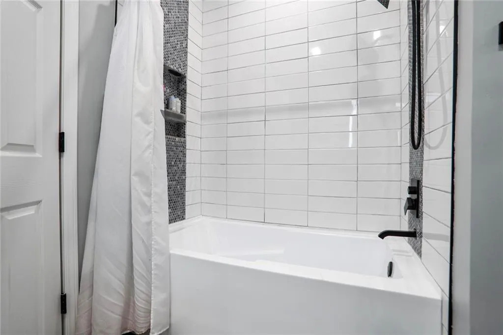 Full bathroom featuring shower / tub combo