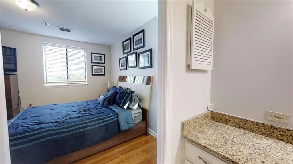 Bedroom featuring light wood-style floors and baseboards