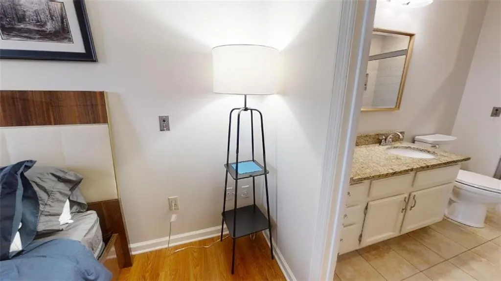 Bathroom with vanity and light wood-style flooring