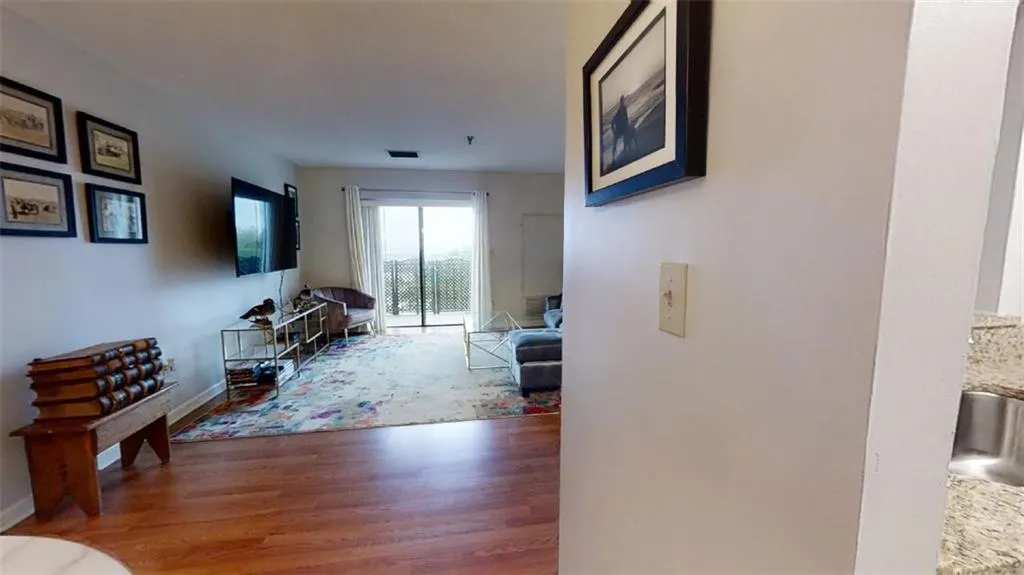 Living area featuring wood finished floors and baseboards