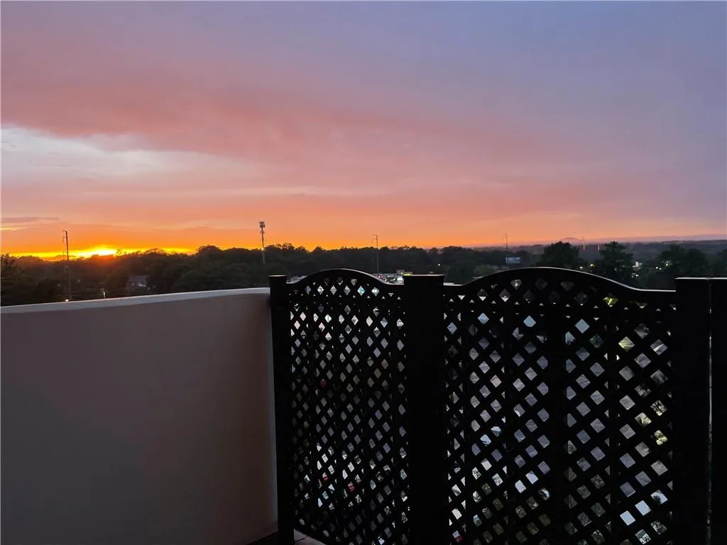 Gate at dusk with a balcony