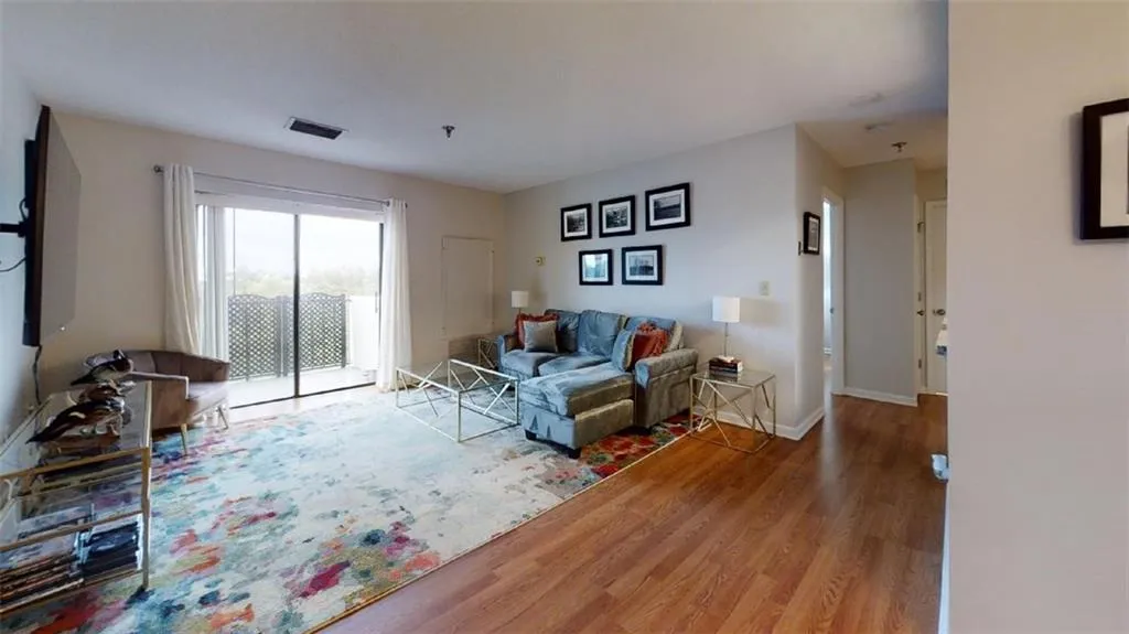 Living room featuring wood finished floors and baseboards