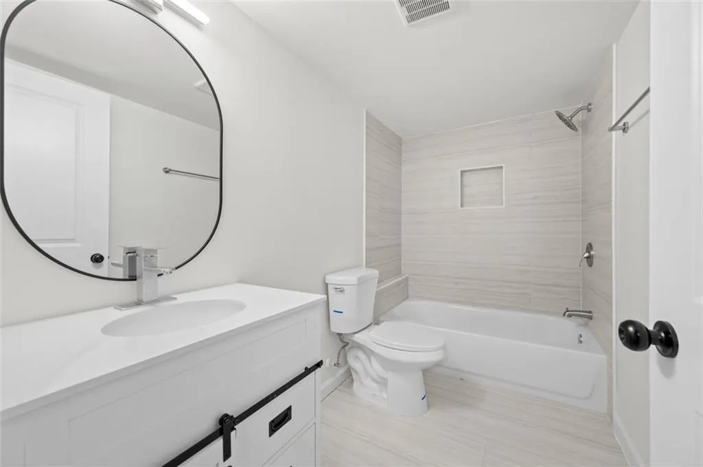 Full bathroom with bathtub / shower combination and vanity