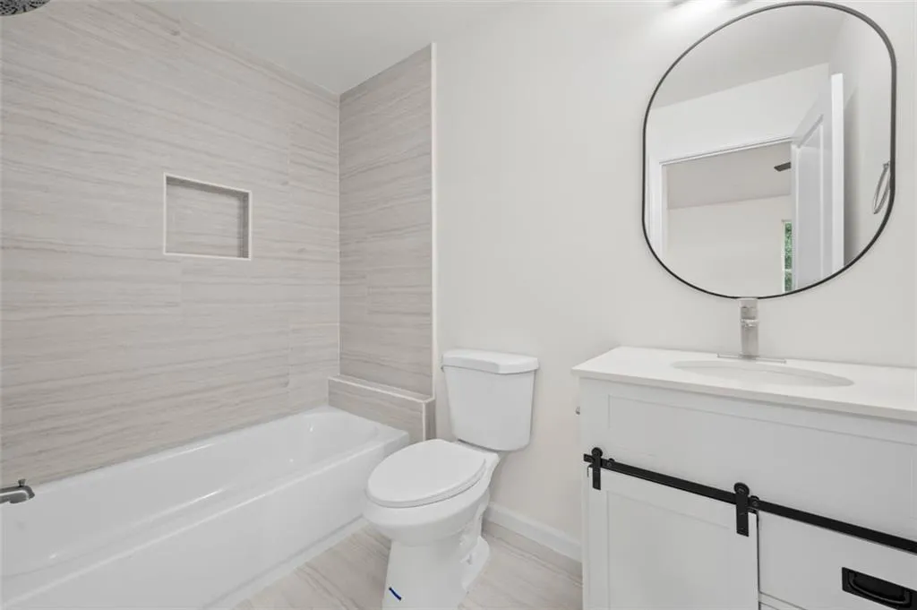 Bathroom featuring vanity and bathtub / shower combination