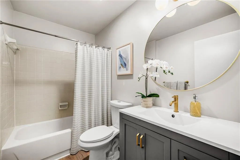 Bathroom with vanity and shower / tub combo
