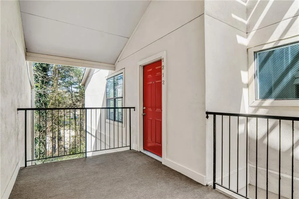 View of exterior entry with stucco siding
