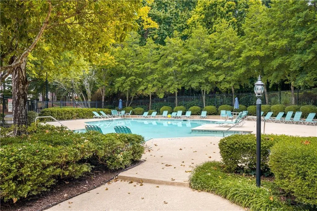 Community pool featuring a patio area
