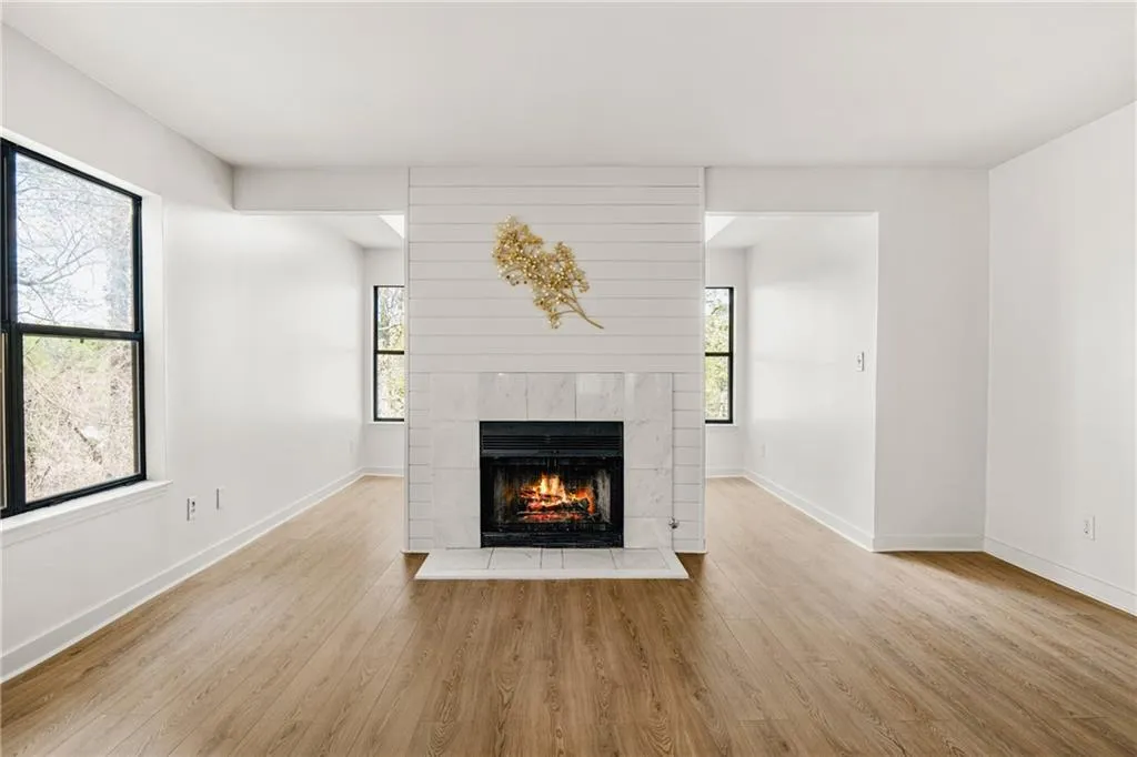 Unfurnished living room with light wood-style floors and a fireplace