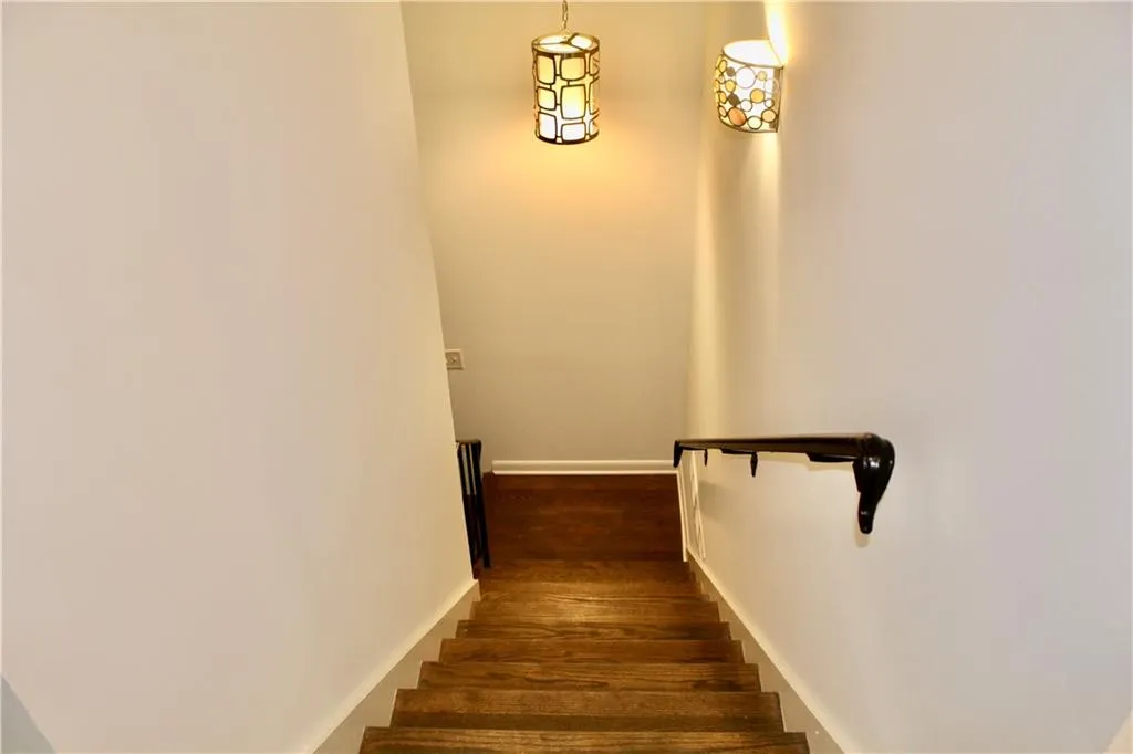 Stairway featuring baseboards