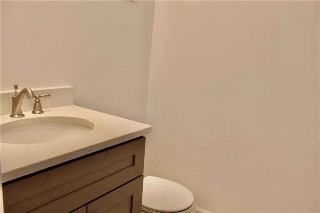 Bathroom with vanity and toilet