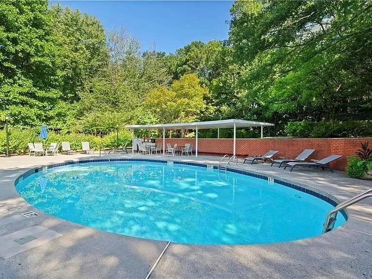 Community pool featuring a patio area
