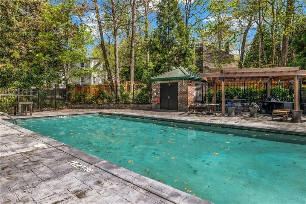 Community pool with a patio and a gazebo