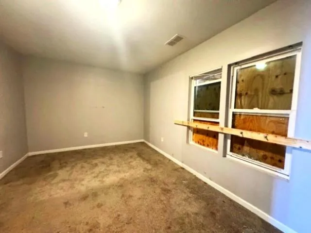 Unfurnished room with carpet floors