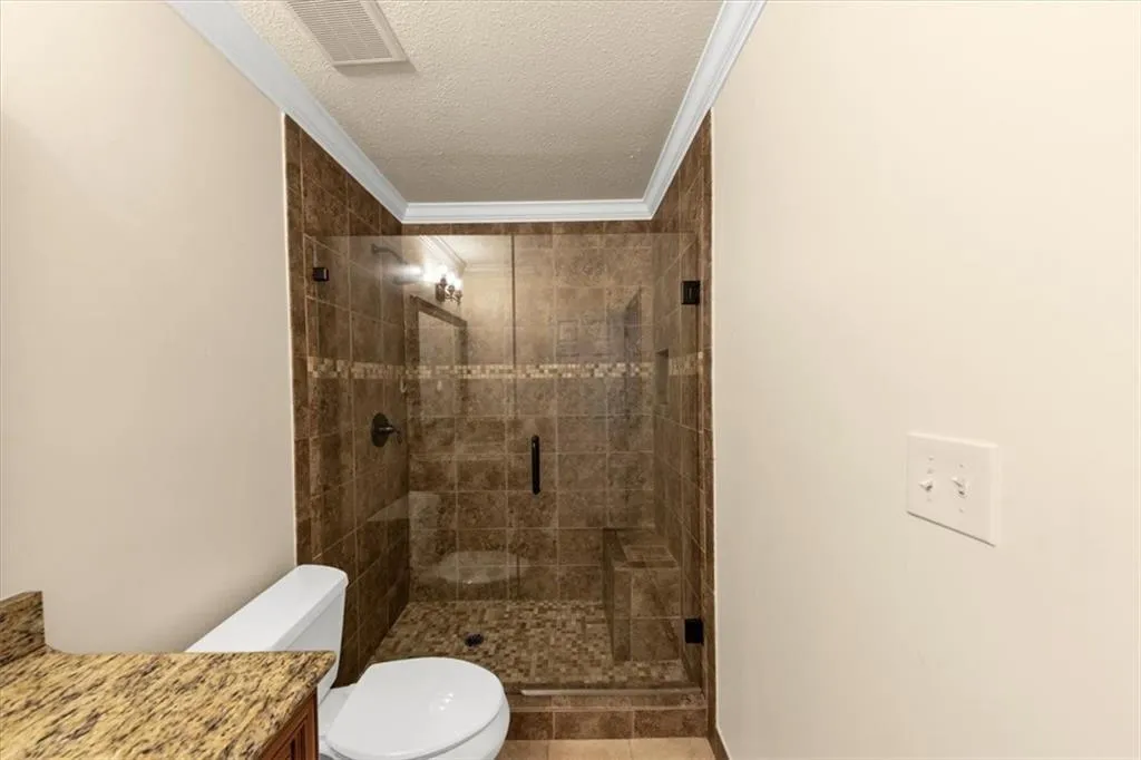 Seamless walk-in tiled  shower in owner's ensuite