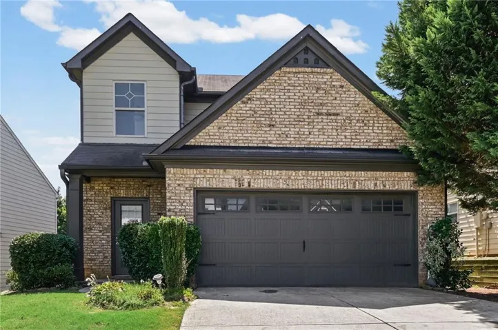 Brick and siding exterior with dark trim accents