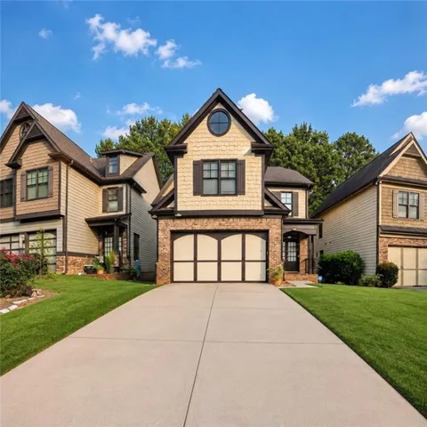 Brick and shingle exterior with dark trim accents