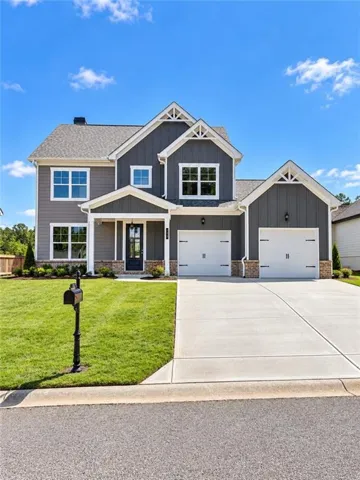 Craftsman-style exterior with mixed siding and stone accents