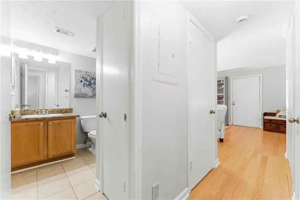 Half bathroom featuring vanity and electric panel