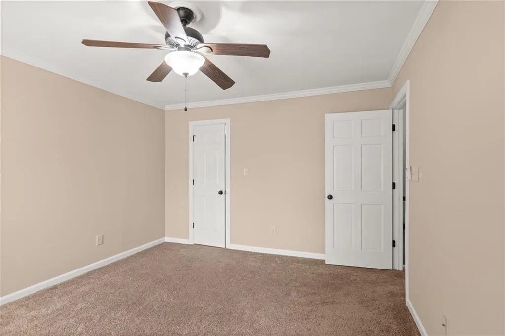 Bedroom 1 features a walk in closet