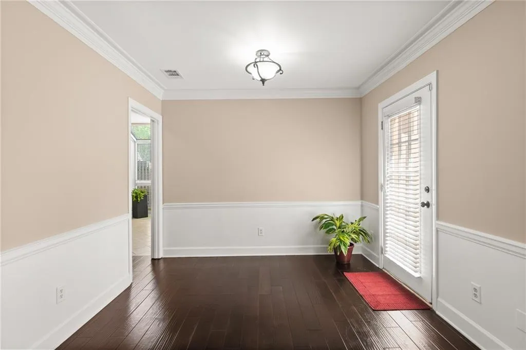 A quaint chandelier shines above the dining room, which connects to your patio.
