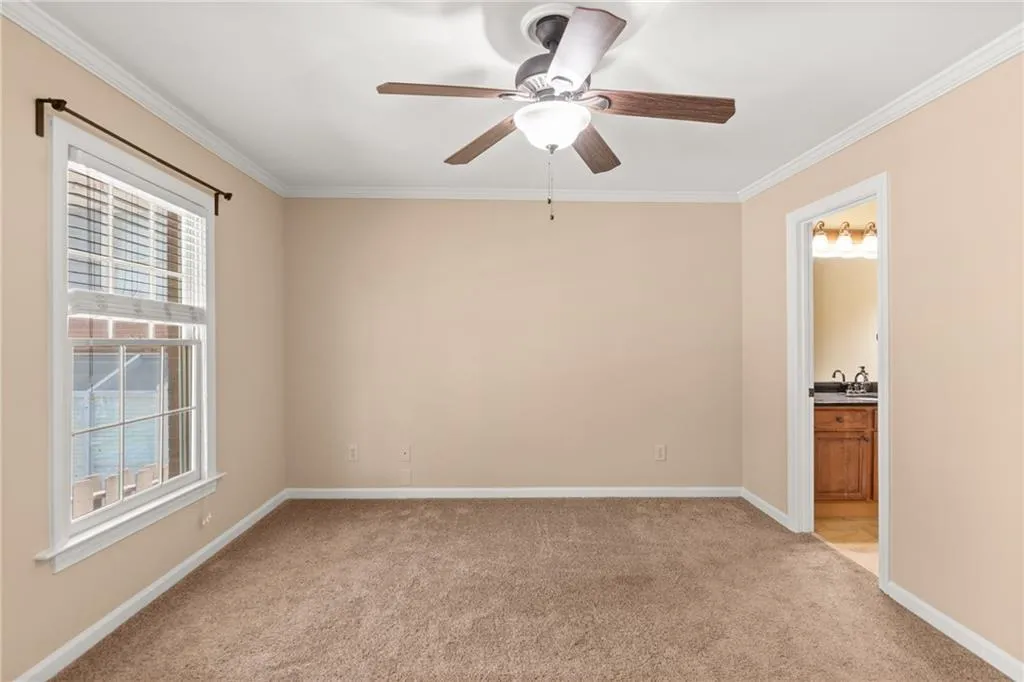 Primary Bedroom with large windows.