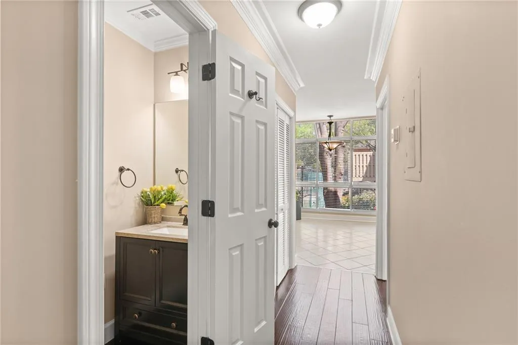 A glimpse into the powder room and hallway to the breakfast area and kitchen.