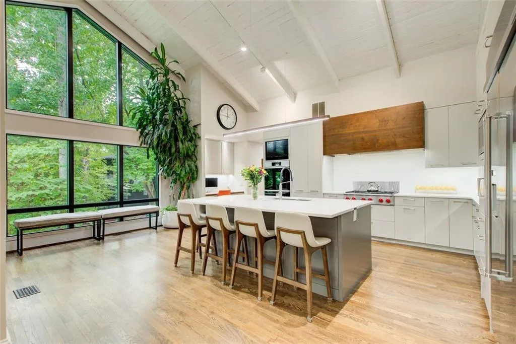 Custom cabinetry and a custom vent hood, stainless steel appliance package