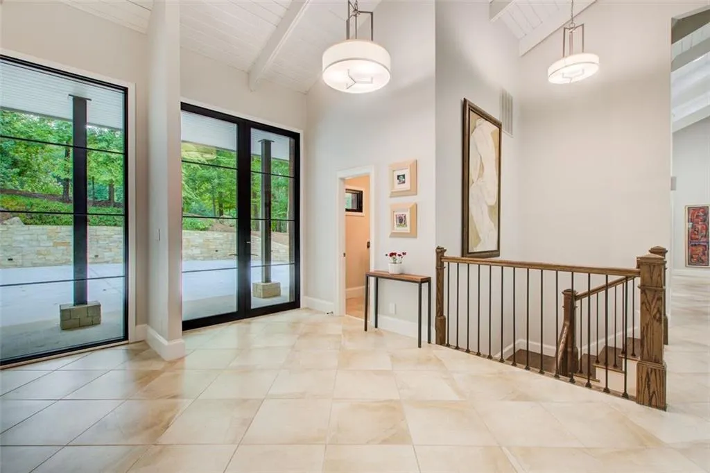 A beautiful and private view. These I beams, lime stone and windows are architecturally designed for functionality and elegance. This home has beautiful space everywhere!