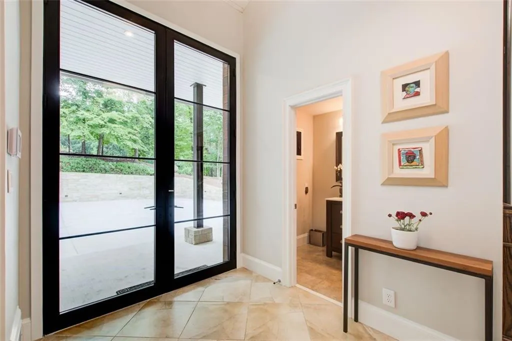 A welcoming entry with steel and glass custom doors.