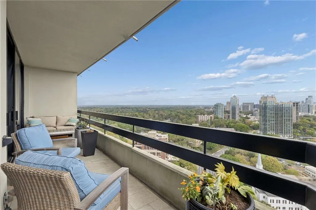 Balcony featuring a city view and an outdoor hangout area