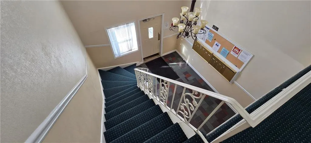 Stairway with an inviting chandelier