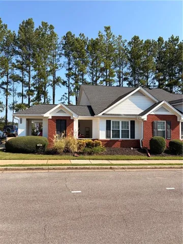 Brick and siding exterior with a covered entry