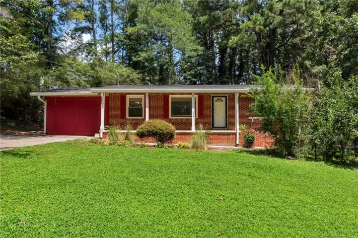 Red brick exterior with white trim