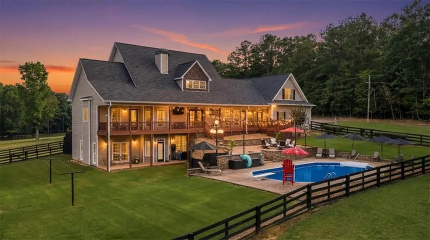 Spacious property featuring a multi-level residence with a covered upper deck and lower patio