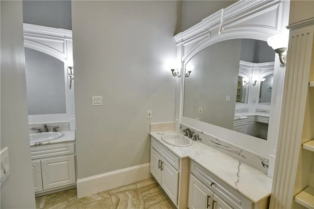 Bathroom featuring baseboards and vanity