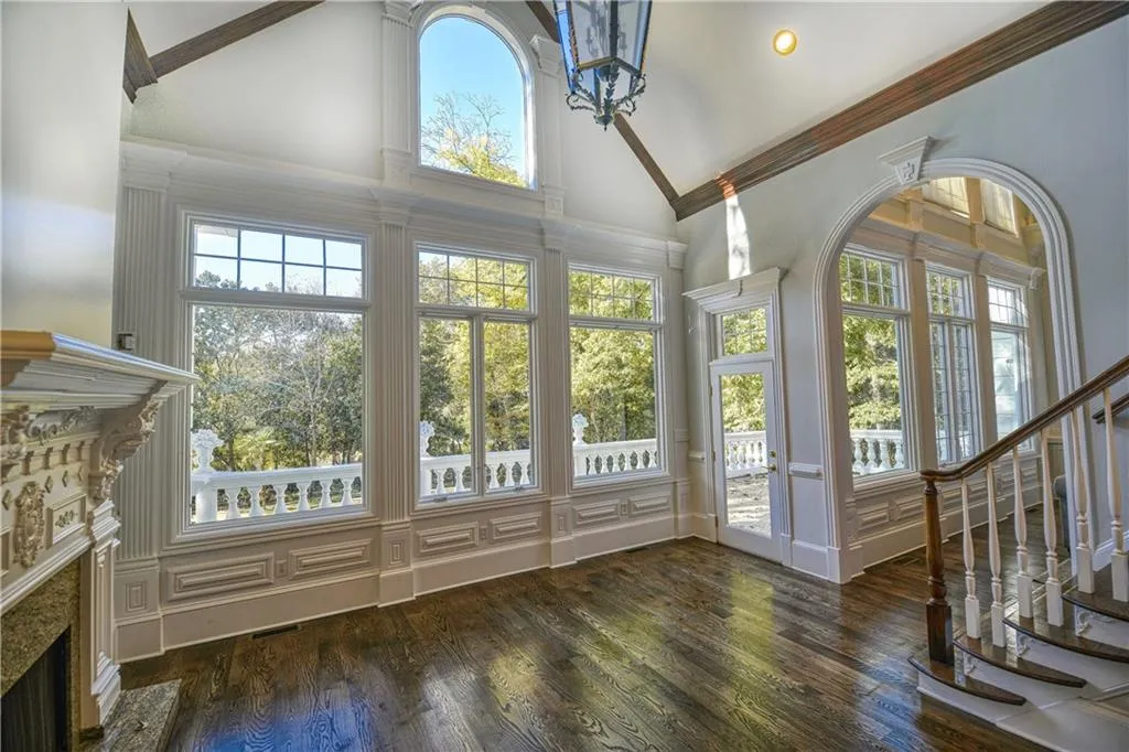 Unfurnished sunroom with plenty of natural light and french doors