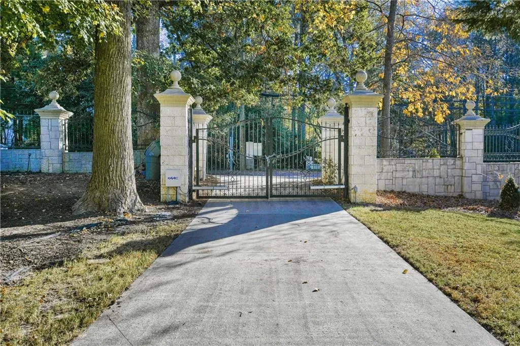 View of gate featuring fence