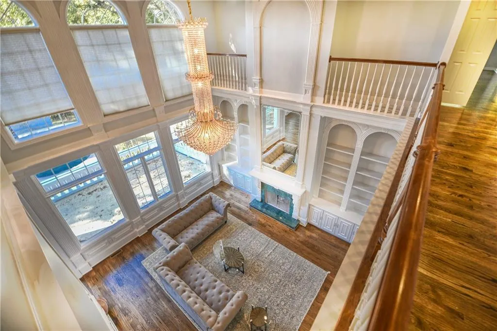 Living area with a chandelier and wood finished floors