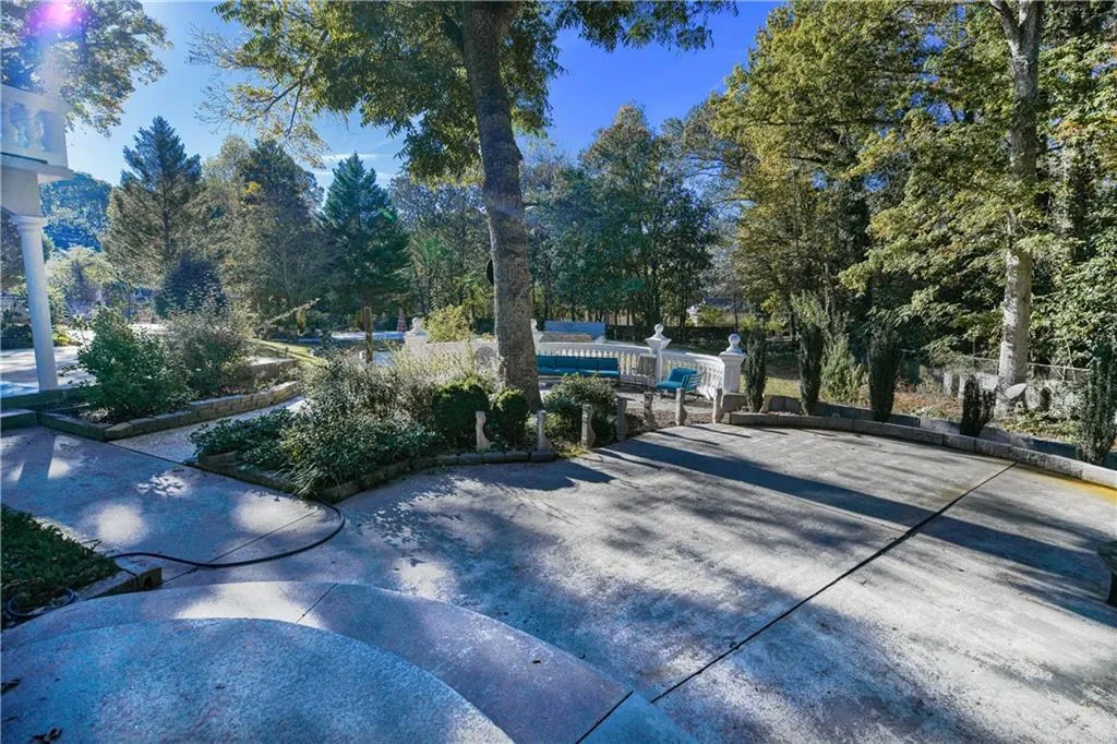 View of street featuring concrete driveway