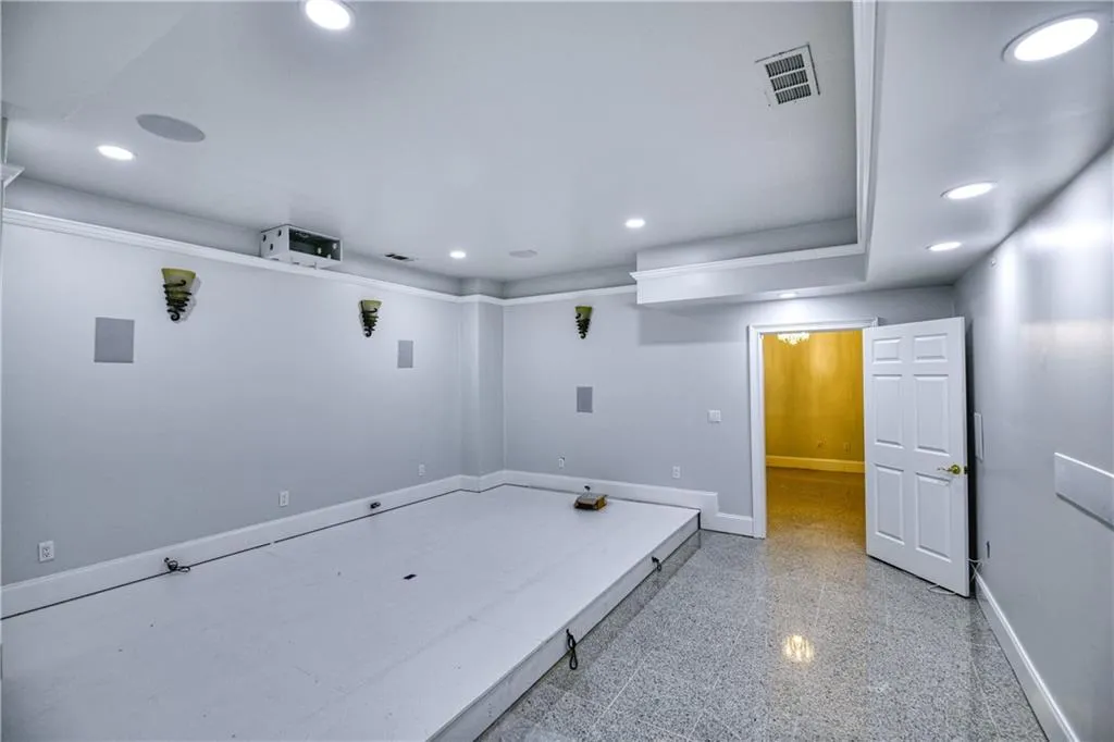 Game room with baseboards, granite finish floor, visible vents, and recessed lighting