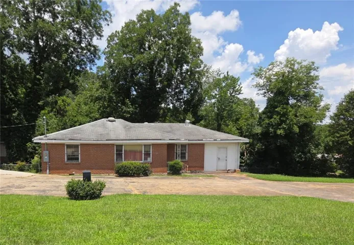 Brick-clad ranch-style office.  Large corner lot with ample parking.