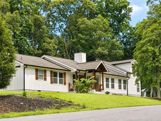 Modern farmhouse exterior with white board and batten siding