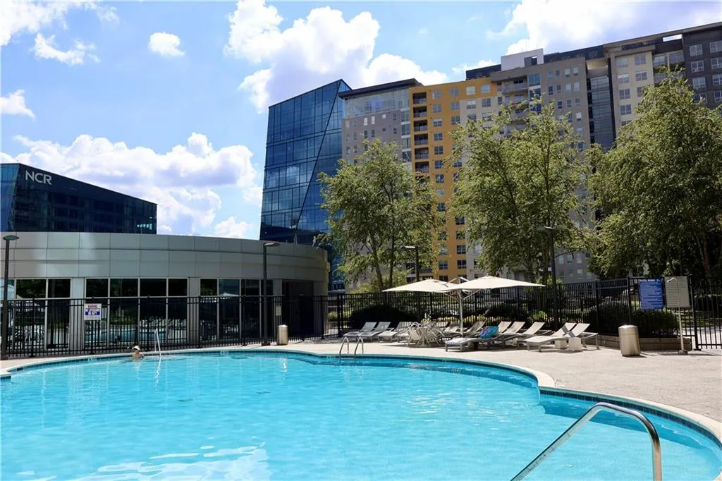 Community pool with a patio