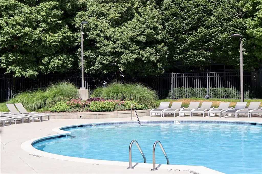 Community pool featuring a patio