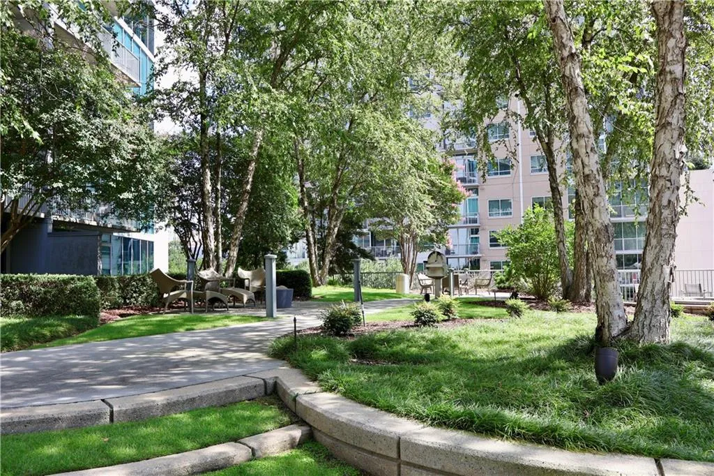 View of property's community with a yard