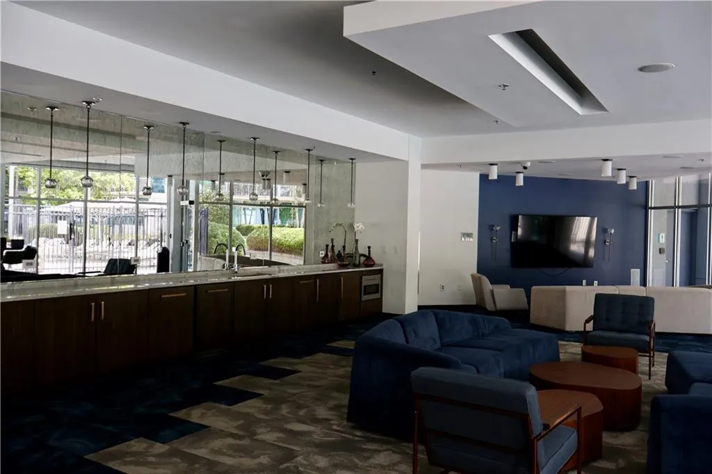 Living area with dark carpet