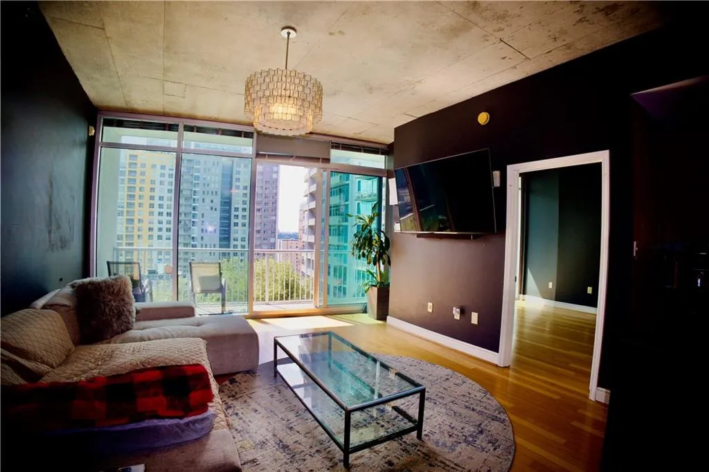 Living room with expansive windows and wood finished floors